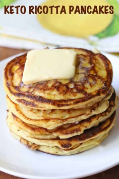 a stack of pancakes with butter on top and the words keto ricotta pancakes