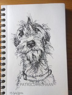 a drawing of a dog on a notebook