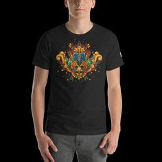 Introducing our latest fashion statement! Our Sri Lanka inspired t-shirt design features an eye-catching "Guralu Raksha ," a traditional symbol of the country's culture. The vivid colours and intricate pattern of the mask will bring a unique and stylish look to any wardrobe. Get ready to make a bold fashion statement with this one-of-a-kind t-shirt design! #SriLanka #YakaMask #FashionStatement #UniqueDesign * 100% combed and ring-spun cotton (Heather colours contain polyester) * Fabric weight: 4 Multicolor Graphic Print Festival T-shirt, Multicolor Short Sleeve T-shirt For Festivals, Traditional Short Sleeve T-shirt With Graphic Print, Graphic Tee Short Sleeve T-shirt For Festivals, Festival Graphic Tee With Short Sleeves, Traditional Printed Black Tops, Traditional Black Printed Top, Multicolor Printed T-shirt For Festivals, Traditional Short Sleeve Graphic Print Top