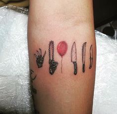 a tattoo with knifes and tomatoes on it