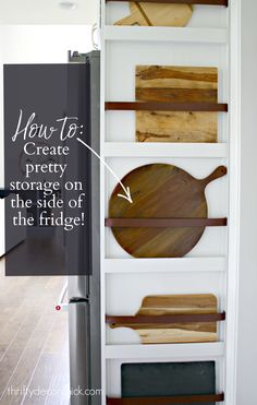 an open refrigerator with wooden cutting boards on the side and text overlay reading how to create pretty storage on the side of the fridge