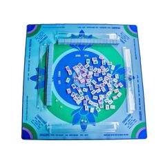 a blue tray with white tiles on top of it and scissors in front of it