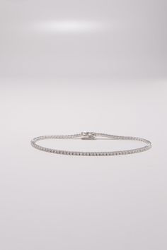 PLX470 Our 1.5mm CZ Tennis Bracelet is meticulously handcrafted in Korea, delivering a unique blend of classic and contemporary aesthetics. Made from 14K solid white gold, this bracelet features a tennis design adorned with cubic zirconia stones, providing a timeless and elegant look. This bracelet is perfect for adding a touch of elegance and sparkle to your everyday look or for special occasions. This tennis bracelet also makes a great gift for occasions like birthdays, holidays, or simply to Modern Silver Platinum Tennis Bracelet, Timeless White Sterling Silver Bracelet With Diamond Accents, Silver Tennis Bracelet For Everyday Luxury, Modern Diamond White Tennis Bracelet With Jubilee Style, Classic Diamond White Tennis Bracelet For Everyday Luxury, White Gold Platinum Tennis Bracelet With Diamond Cut, Silver Diamond Tennis Bracelet For Everyday Luxury, Platinum White Gold Tennis Bracelet With Diamond Cut, Modern Diamond White Platinum Tennis Bracelet