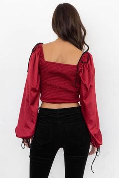 Red and black polkadot crop top with ruched detailing and bell sleeves. Chic Ruched Crop Top For Fall, Trendy Long Sleeve Ruched Crop Top, Cropped Top With Gathered Sleeves For Fall, Cropped Blouse With Gathered Sleeves For Fall, Casual Crop Top With Gathered Sleeves, Fitted Cropped Crop Top With Elastic Sleeves, Fitted Crop Top With Elastic Sleeves, Fitted Crop Top With Gathered Sleeves, Fall Ruffled Crop Top