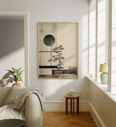 a living room with a couch, table and potted plant on the wall next to it