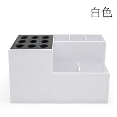 a white box with black dots on it