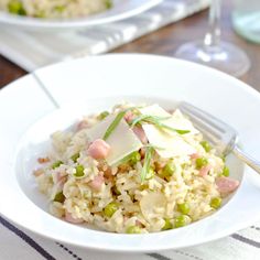 a white plate topped with rice and peas