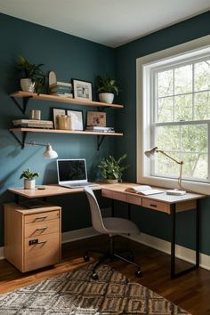 a desk with a laptop on it in front of a window and bookshelves