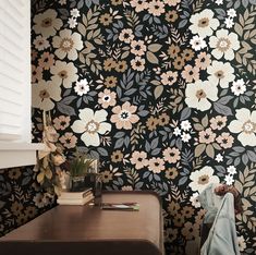 the wall paper has flowers and leaves on it