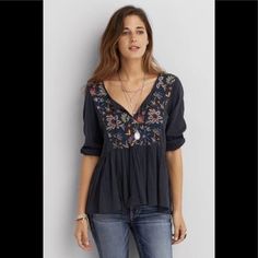 American Eagle Outfitters Embroidered Tassel V Boho Tunic. Navy Blue. Rope Tassel Tie-Front. Embroidered Yoke. Loose Peplum Bohemian Boho Fit. Cotton Viscose Blend. Blue V-neck Tops With Tassels, Blue V-neck Top With Tassels, 24th August, Bushy Eyebrows, Rope Tassel, Boho Fits, Pretty Embroidery, Embroidery Vintage, Sparkle Shoes