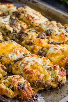 a casserole dish with meat and cheese on it, ready to be eaten