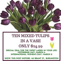 a bunch of purple tulips in a vase on sale for $ 24 99