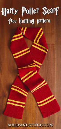 the harry potter scarf is knitted in red and yellow stripes, on a wooden floor