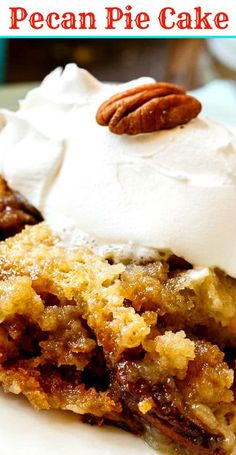 a piece of pecan pie cake on a plate with whipped cream and pecans