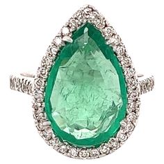 This ring has a Pear Cut Emerald that weighs 4.19 carats. It has 49 Round Cut Diamonds that weigh 0.64 carats. The total carat weight of this ring is 4.83 carats. The Pear Cut Emerald measures at 17 mm x 12 mm. The ring is also GIA certified. The certificate number is: 5222314202. The ring is curated in 18 Karat White Gold and weighs approximately 5.2 grams. This ring is a size of 7 and can be re-sized at no additional charge. Gold Cocktail Ring, Gold Cocktail, Gem Stone, Emerald Diamond, Pear Cut, Cocktail Ring, Round Cut Diamond, Cocktail Rings, Diamond White