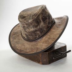 A hard-working hat with American Outback style. The durable Limited Edition Leather Outback Hat is the perfect hat to accompany you to every corner of the globe. Available in several exclusive leather finishes, this hat will be a welcome addition to any wardrobe. Some even say it makes your mojo shine... #hats #leatherhats Australian Hats, Aussie Hat, Australian Hat, Outback Hat, Australian Outback, Leather Hats