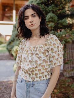 This cropped boho top is the epitome of romantic summer wear. Feel free as a bird in block printed 100% cotton, with an elastic neckline, and off the shoulder versatility depending on your mood. Add to a flowy skirt for relaxed vibes, or pair with a fitted jean and head out for the night. 100% cotton Hand block printed Length of size M is 12" from top of bodice Made fair trade in India by one of our longstanding production partners This textile has been printed by hand using traditional techniqu Cotton Crop Top For Jeans, Square Neck Crop Top For Spring Vacation, Spring Cotton Peasant Top With Square Neck, Cotton Smocked Top With Floral Print For Day Out, Cotton Square Neck Top For Vacation, Square Neck Cotton Tops For Vacation, Cotton Tops With Square Neck For Vacation, Cotton Peasant Top With Square Neck, Bohemian Smocked Top For Vacation