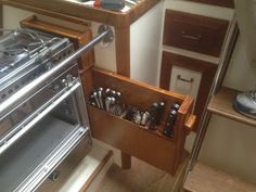 the inside of a small kitchen with an oven and counter space for cooking utensils