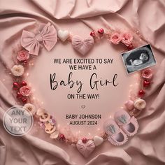 a heart shaped frame with baby's shoes on it and the words, we are excited to say we have a baby girl on the way