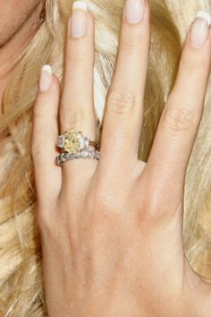 a close up of a person wearing a ring