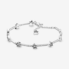 Let yourself be inspired by our magical, dreamy world based on the mystery of the night sky and the brilliance of starlight. Our star bracelet features a collection of irregularly-shaped sterling silver star shapes embellished with round cubic zirconia stones bound together by pavé bars to evoke a life beyond your wildest dreams, with each star symbolizing a past milestone or a future achievement. Let the sterling silver bracelet remind you of all of the proud moments that make you, you. Pandora Stars Bracelet, Pandora Star, Celestial Stars, Bracelet Tennis, Bracelet Pandora, Jewelry Accessories Ideas, Star Bracelet, Bead Charm Bracelet