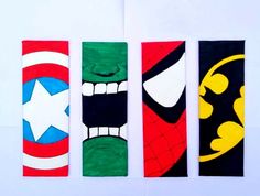 four superhero themed hand towels on a white surface