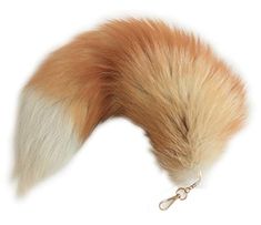 the tail of a fox tail is attached to a keychain on a white background