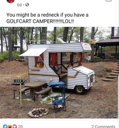 an old camper is parked in the woods