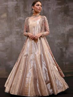 <p><strong>Over-Top:<br /></strong>Color: Vivid Tangerine<br />Fabric: Organza<br />Long shirt adorned beautifully with floral embellishments accent the neckline, all over front, sleeves, front borders and hemline<br />Light embellishments on back<br />Full sleeves<br />Split front<br />Fully lined<br />Edges finished<br /><br /><strong>Under-gown:<br /></strong>Color: Vivid Tangerine<br />Fabric: Tissue Organza<br />Comes with plain floor length gown<br />Rounded neckline<br />Sleeveless<br />H Pakistani Gown, Tangerine Wedding, Tissue Dupatta, Nida Azwer, Nikah Dress, Walima Dress, Puffy Skirt, Indian Bridal Dress, Pakistani Wedding Dresses