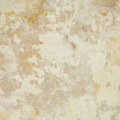 an old, dirty wall with yellow paint and chippings on the surface is shown