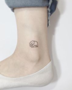 a small elephant tattoo on the ankle