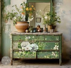 an old dresser with flowers painted on it and a mirror in the corner next to it