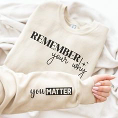 "Embrace motivation and positivity with our Gildan 18000 sweatshirt, featuring the powerful message \"Remember Your Why\" on the front and \"You Matter\" on the sleeve. Crafted to inspire and remind you of your purpose and worth, this sweatshirt is more than just a piece of clothing--it's a wearable affirmation. Why You'll Love This Sweatshirt: Empowering Messages: With \"Remember Your Why\" prominently displayed and \"You Matter\" on the sleeve, this sweatshirt serves as a constant reminder of your value and goals. Premium Comfort: Made with the soft, durable fabric of the Gildan 18000, this crewneck ensures both comfort and longevity, making it perfect for everyday wear. Versatile Style: Its classic, unisex fit makes it a versatile addition to any wardrobe, suitable for all genders and a Inspirational Long Sleeve Sweatshirt With Text Print, Inspirational Slogan Sweatshirt For Fall, Inspirational Slogan Sweatshirt In Relaxed Fit, Inspirational Text Print Sweatshirt With Relaxed Fit, Inspirational Long Sleeve Sweatshirt With Graphic Print, Inspirational Long Sleeve Sweatshirt With Letter Print, Inspirational Letter Print Long Sleeve Sweatshirt, Inspirational Long Sleeve Letter Print Sweatshirt, Inspirational Slogan Sweatshirt For Streetwear