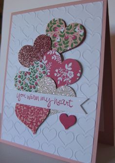 a close up of a card with hearts on it