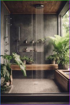 a bathroom with plants and a shower head in the middle of the bathtub is surrounded by greenery