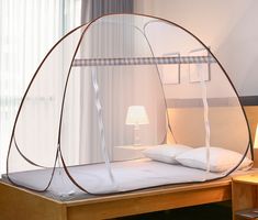 a bed with a white canopy over it