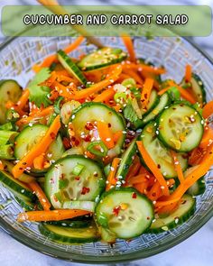 cucumber and carrot salad in a glass bowl with sesame seeds on the side