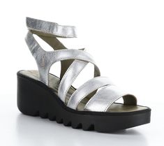 Stand out on the boardwalk with these wedge sandals boasting a metallic finish and a platform silhouette that elevates your style to new heights. From Fly London. Silver Sandals, Fly London, Leather Wedge Sandals, Leather Wedges, Wedge Sandal, Metallic Leather, Cow Leather, Wedge Heels, Wedge Sandals