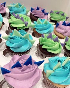 cupcakes with blue, green and purple frosting