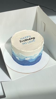 a birthday cake is sitting in a box