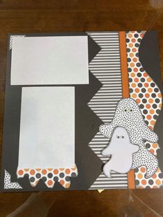 a halloween themed scrapbook with ghost and polka dots