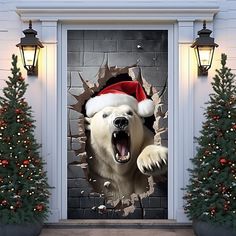 a large white polar bear wearing a santa hat through a hole in a brick wall