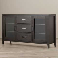 the sideboard has glass doors and is dark brown with silver hardwares on it