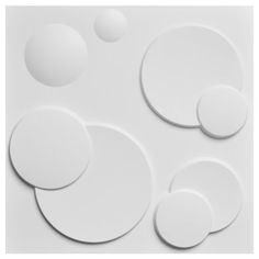 white circles are arranged on a white surface