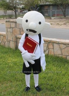 a person in a costume holding a book