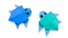 two origami fish made out of paper