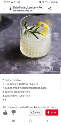 a glass with lemon and rosemary garnish in it