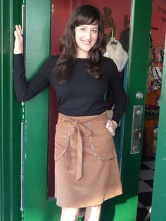 "Cutie-pie Wrap Skirt. Camel colored 21-wale Corduroy 70's Inspired wrap skirt, easy, flattering, wear it on date night, work or brunch. A-Line, wraps in back, deep front pockets with paisley print piping. 100% cotton corduroy. 21 wale corduroy that's buttery soft. Impeccable attention to tailored details. Skirt sits at natural waist. Please specify size when ordering: US Sizes Small through X-Large (adjustable waist) Small (4/6) 29\" Waist Skirt length 21 1/2\" Medium (8/10) 31\" Waist Skirt le Night Work, On Date, 70s Inspired, Camel Color, Cutie Pie, Wrap Skirt, Paisley Print, Skirt Length, Waist Skirt