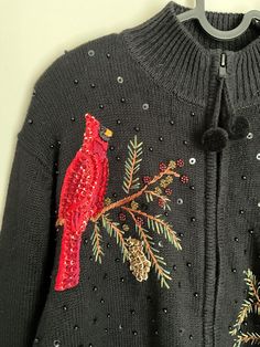 Vintage Black Sequins Red Cardinal Christmas Zip Up Sweater - Large  This beautiful Cardinal Christmas sweater is so great and perfect for Christmas time! This is also great for those who love cardinals! This sweater is great for the finishing look for a Christmas or holiday party, family pictures, or just for your every day outfits. There is no damage to this sweater. This sweater has not been washed by me. There may be a vintage smell to it.  24" long shoulder to hem  22" UA to UA laying flat Red Cardinal Christmas, Cardinal Christmas, Red Cardinal, Zip Up Sweater, Family Pictures, Black Sequins, Cardinals, Christmas Sweater, Holiday Party