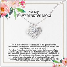 a necklace with the words to my boyfriend is mcm on it and flowers around it